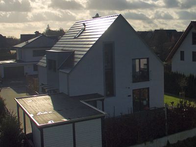 Einfamilienhaus in Verl, Putz, Satteldach ohne Überstand